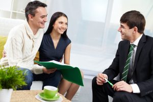 couple talking with a agent