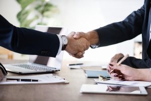 commercial insurance business people holding hands